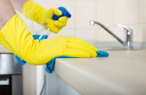 Team following a health and safety policy during cleaning work