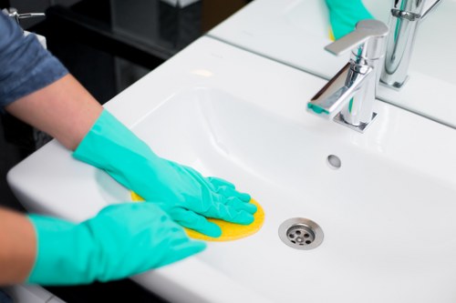 Bathroom surfaces and fixtures being refreshed before new occupants arrive