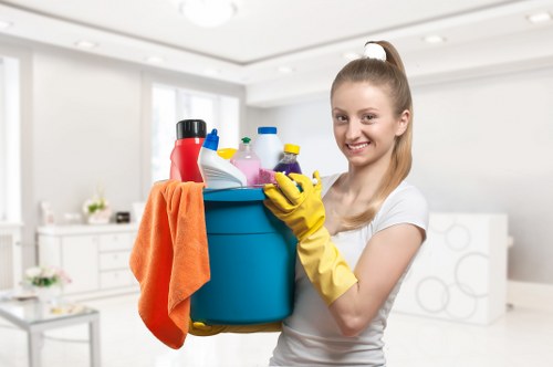 Kitchen cupboards and worktops being cleaned during a move in clean