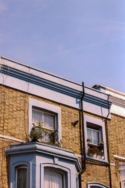A rectangular white sign with black lettered text that reads 'Welcome to South Kensington SW7' mounted on a brick wall with reddish-brown bricks. The sign has a simple black border and is photographed in natural daylight, indicating a well-maintained exterior. This image illustrates the importance of surface cleaning and maintenance of signage for hygiene and presentation, consistent with professional cleaning standards promoted by Cleaners Kentish Town in relation to spotting poor cleaning workmanship. The bricks and sign are clean and free of dust or stains, highlighting good surface scrubbing and preservation.